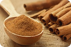 Cinnamon sticks and powder, studio shot, wood background,