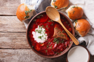 Ukrainian borsch soup and garlic buns on the table